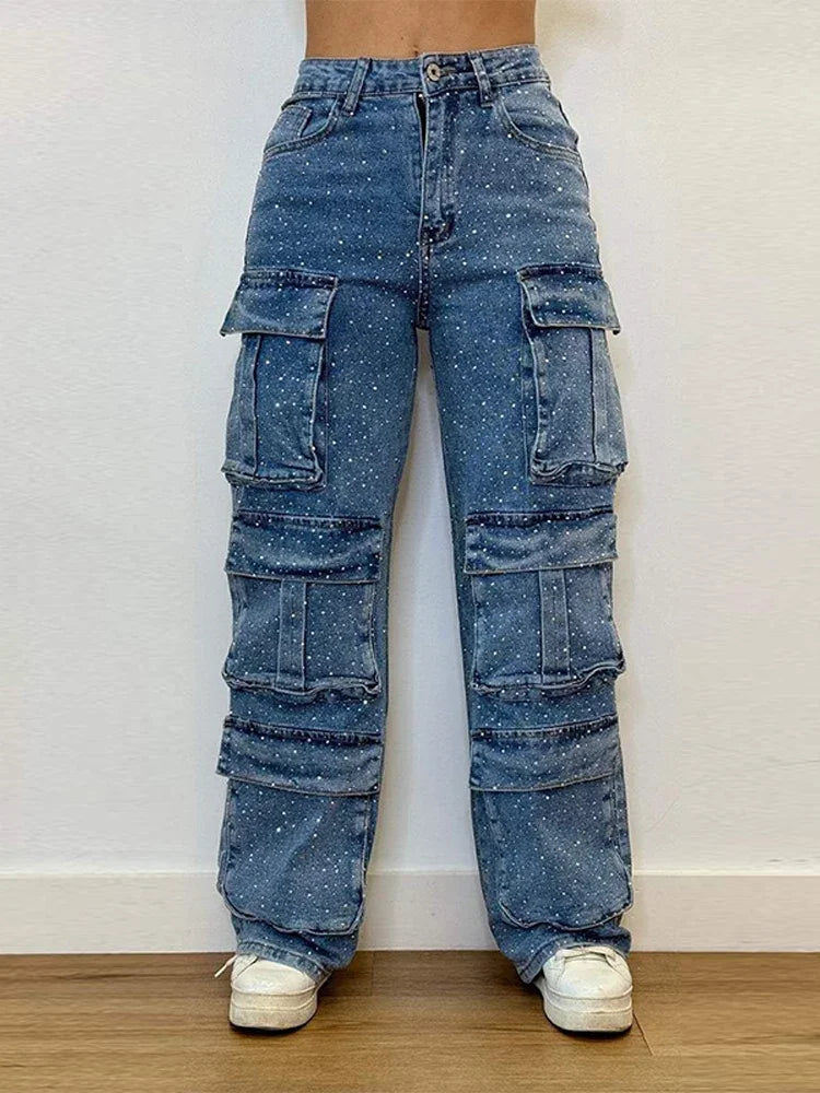 Front view of high-waisted rhinestone Blue jeans with polka dots, worn by a fashion model at Home.