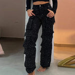 Front view of high-waisted rhinestone jeans with polka dots, worn by a fashion model at Home.